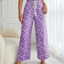 Pantalones largos con cintura con cordon y estampado floral