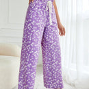 Pantalones largos con cintura con cordon y estampado floral