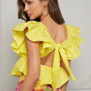 Top de peplum con mangas de volantes y lazo en la espalda