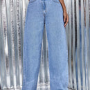 Jeans de talle alto bajo crudo de pierna ancha