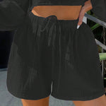 Shorts de pierna ancha unicolor de cintura con cordon