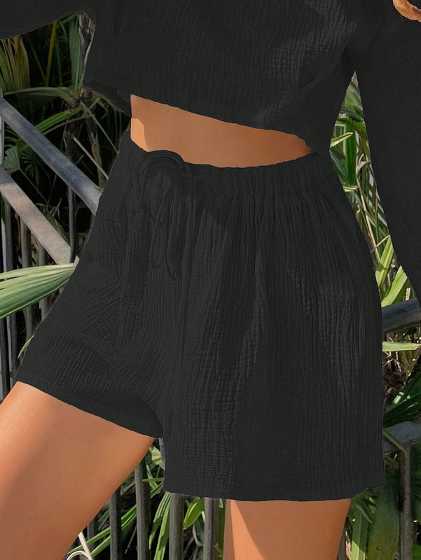 Shorts de pierna ancha unicolor de cintura con cordon