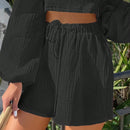 Shorts de pierna ancha unicolor de cintura con cordon
