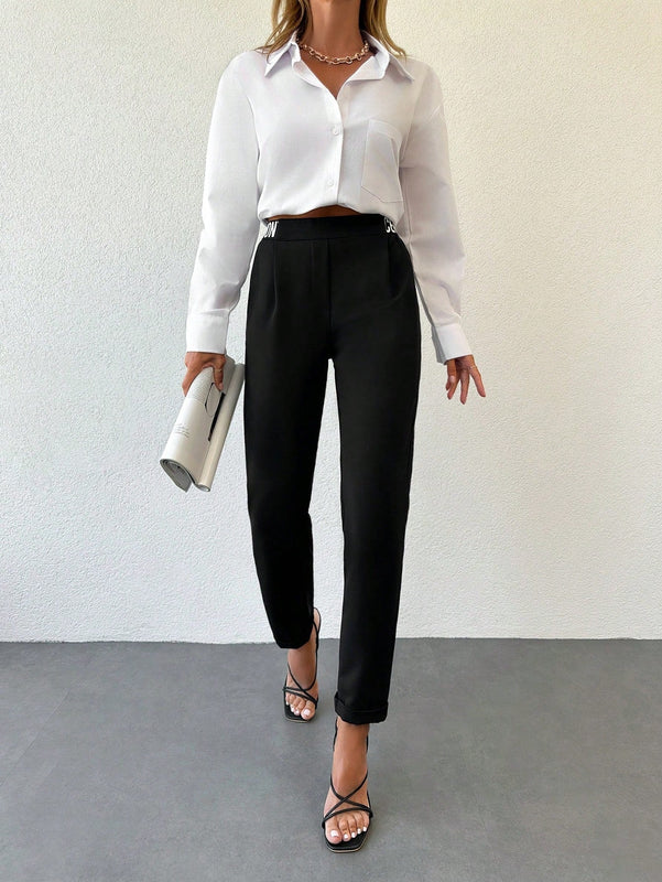 Pantalones conicos con cinta con letra