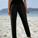 Pantalones conicos unicolor con cordon delantero