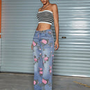 Jeans de pierna recta con bolsillo inclinado y estampado floral vintage