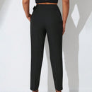 Pantalones zanahoria con bolsillo oblicuo liso
