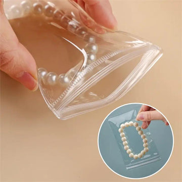 50/100 bolsas transparentes con cierre hermético de PVC, bolsas para joyería, resistentes al polvo y la oxidación, para guardar aretes, anillos, collares, pulseras, dijes y artículos pequeños, 2 tamaños a elegir (Cajas y organizadores de joyería)