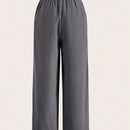 Pantalones sueltos de pierna ancha de color solido para mujer con dobladillo fluido, estilo casual