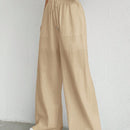 Pantalones sueltos de pierna ancha de color solido para mujer con dobladillo fluido, estilo casual
