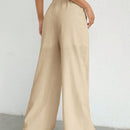 Pantalones sueltos de pierna ancha de color solido para mujer con dobladillo fluido, estilo casual