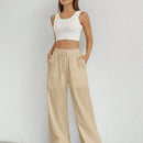 Pantalones sueltos de pierna ancha de color solido para mujer con dobladillo fluido, estilo casual