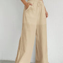 Pantalones sueltos de pierna ancha de color solido para mujer con dobladillo fluido, estilo casual