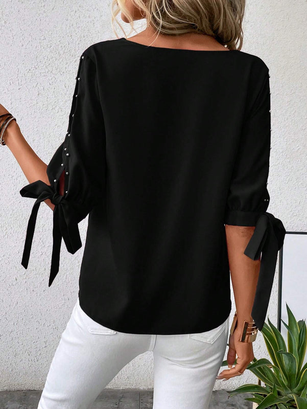 Blusa con cuenta de perla de manga con abertura ribete en abanico amarre en manga