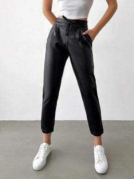 Pantalones largos de tela metalica con nudo frontal para mujer