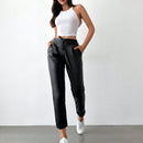Pantalones largos de tela metalica con nudo frontal para mujer