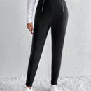 Pantalones ajustados cremallera con diseno de aro O