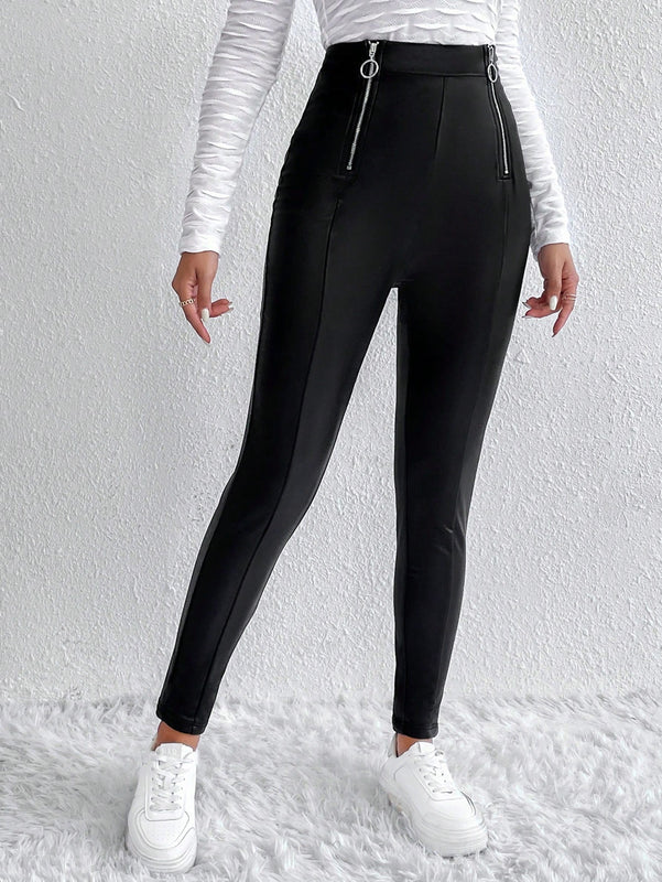 Pantalones ajustados cremallera con diseno de aro O