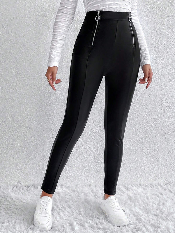 Essnce Pantalones ajustados cremallera con diseno de aro O
