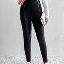 Pantalones ajustados cremallera con diseno de aro O