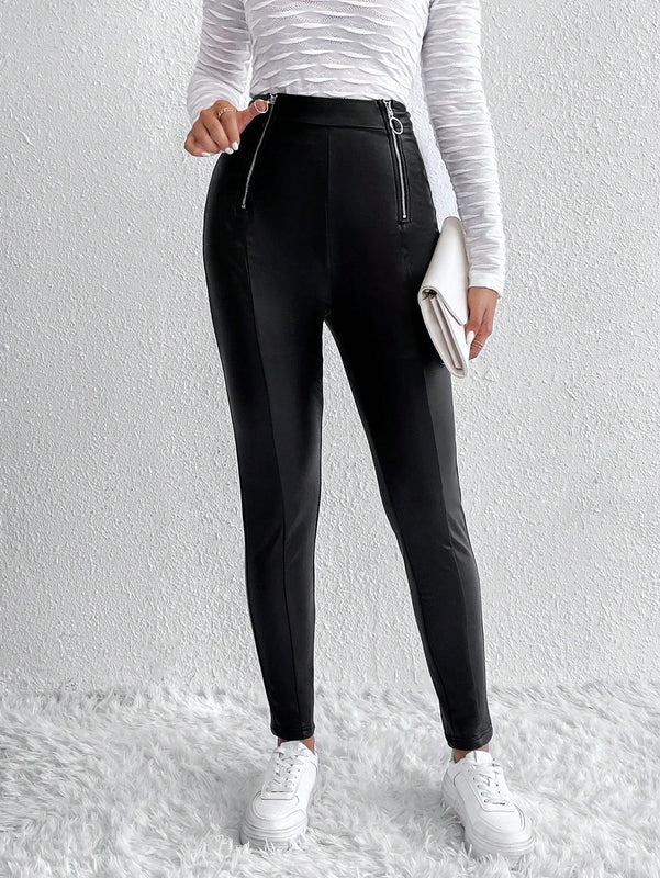 Pantalones ajustados cremallera con diseno de aro O