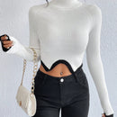 Essnce Jersey crop cuello alto de manga raglan bajo asimetrico