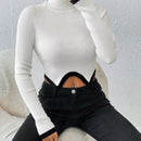 Essnce Jersey crop cuello alto de manga raglan bajo asimetrico