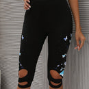Pantalones capri con estampado de mariposa con abertura