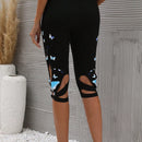 Pantalones capri con estampado de mariposa con abertura