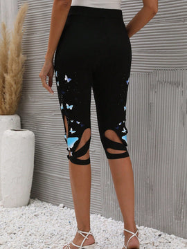 Pantalones capri con estampado de mariposa con abertura