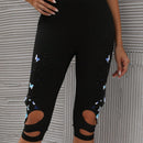 Pantalones capri con estampado de mariposa con abertura