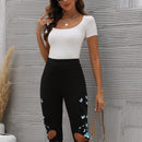 Pantalones capri con estampado de mariposa con abertura