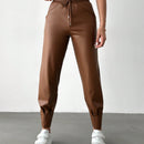 Pantalones con punos elasticos y cintura con cordon de color liso para mujer