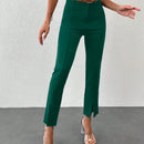Pantalones unicolor bajo con abertura con cinturon
