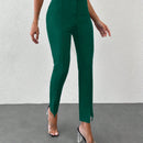 Pantalones unicolor bajo con abertura con cinturon