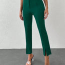 Pantalones unicolor bajo con abertura con cinturon