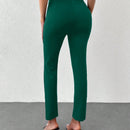 Pantalones unicolor bajo con abertura con cinturon