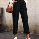 Pantalones unicolor con bolsillo oblicuo de cintura elastica