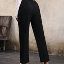 Pantalones unicolor con bolsillo oblicuo de cintura elastica
