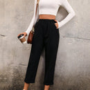 Pantalones unicolor con bolsillo oblicuo de cintura elastica