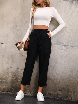 Pantalones unicolor con bolsillo oblicuo de cintura elastica