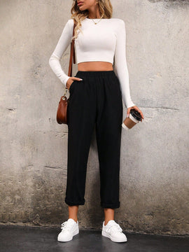 Pantalones unicolor con bolsillo oblicuo de cintura elastica