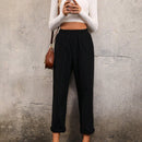 Pantalones unicolor con bolsillo oblicuo de cintura elastica
