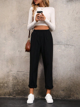 Pantalones unicolor con bolsillo oblicuo de cintura elastica