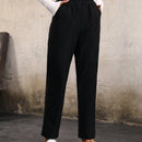 Pantalones unicolor con bolsillo oblicuo de cintura elastica