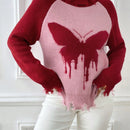 Essnce Sueter roto con patron de mariposa cuello alto de manga raglan