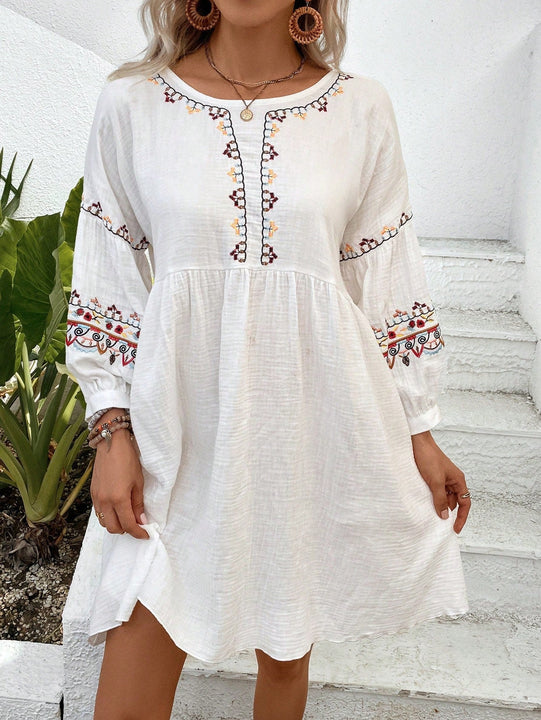 Vestido smock con bordado floral de manga farol