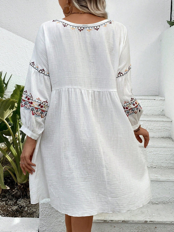 Vestido smock con bordado floral de manga farol