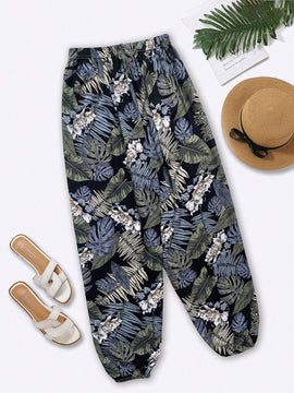 VCAY Pantalones zanahoria con estampado tropical