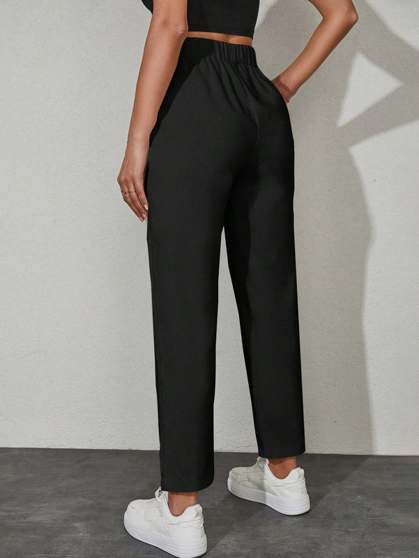 Pantalones unicolor con bolsillo oblicuo de cintura con cordon